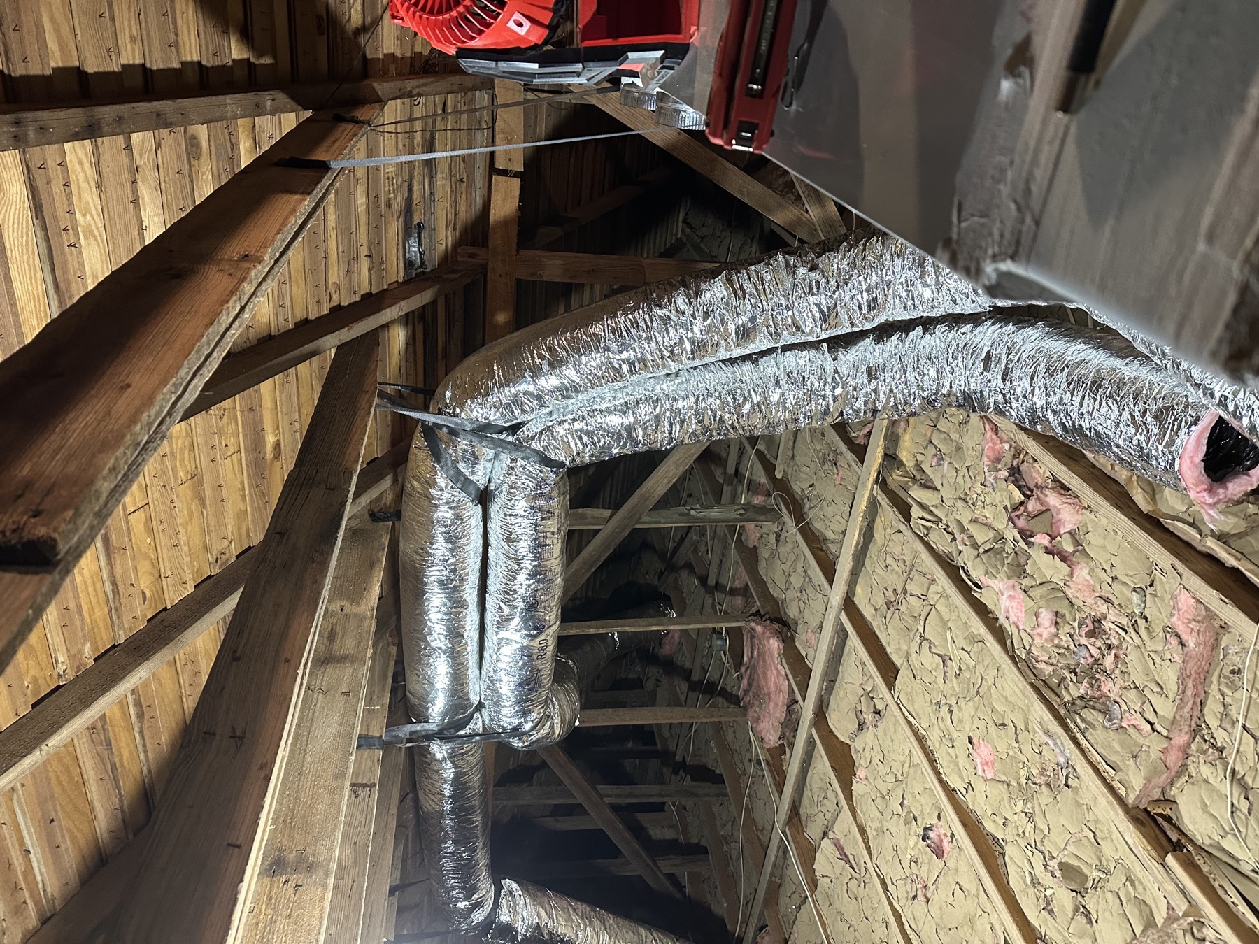 Attic air handler and flex duct runs serving the upstairs of a new construction home in Rock Hill, SC
