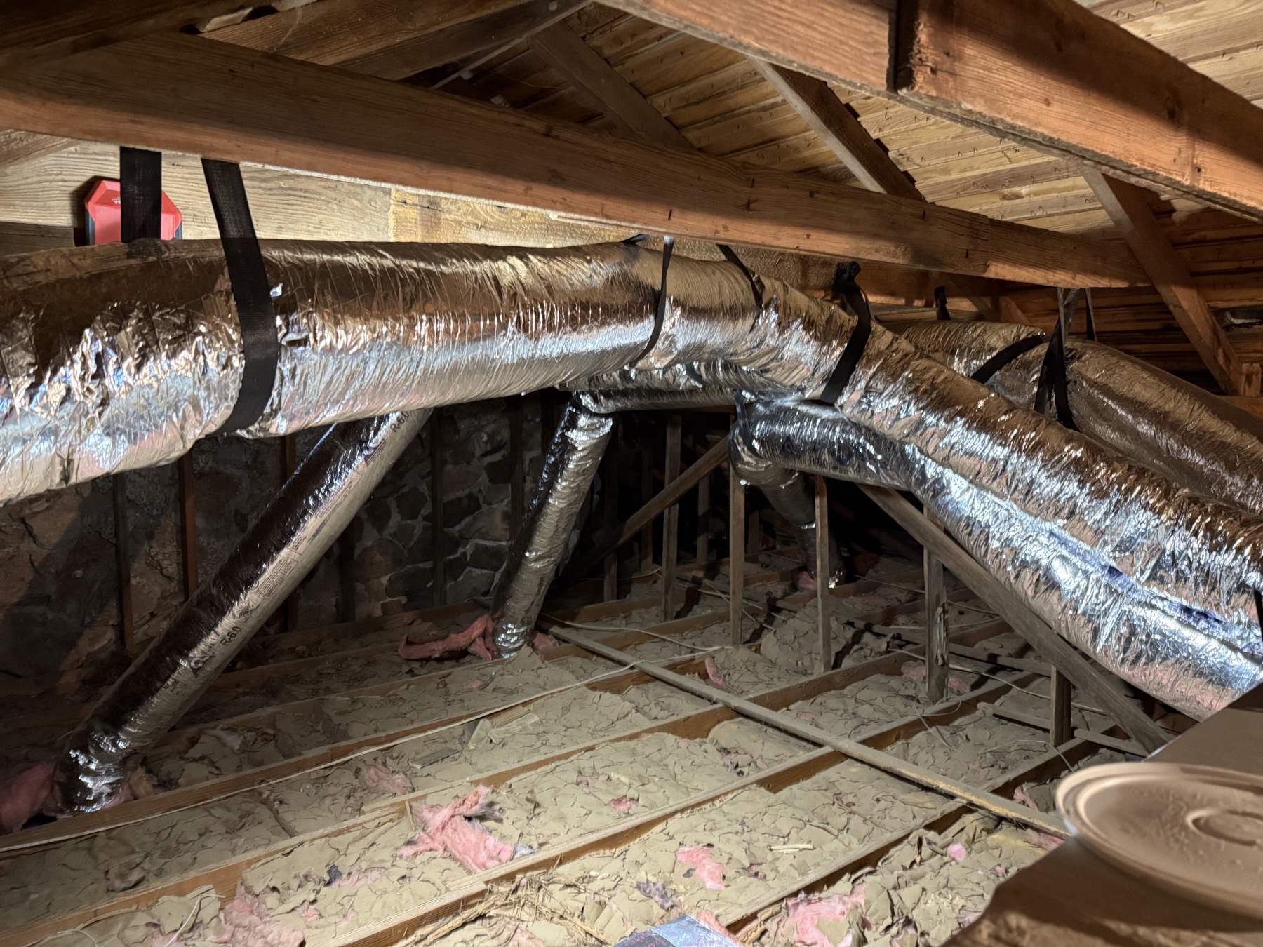 New insulated flex ductwork running through an attic, fabricated in the EZ warehouse