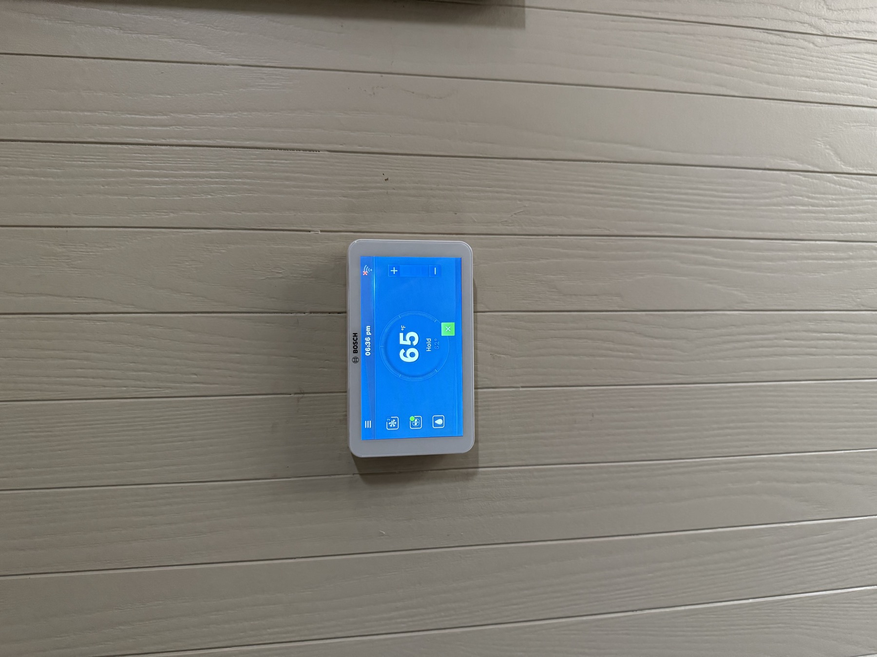 Bosch smart thermostat mounted and configured by EZ Heating and Cooling