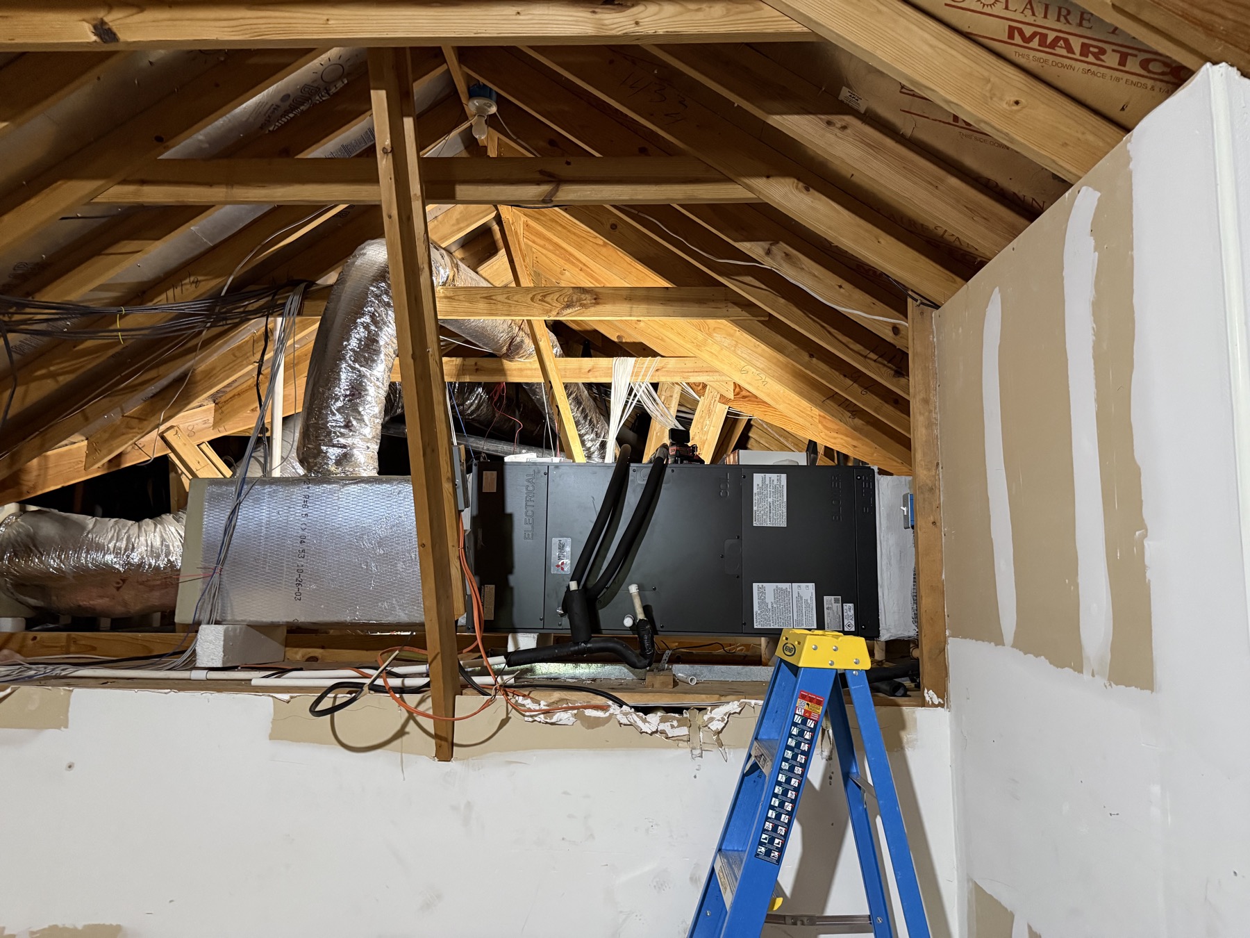 Replacement air conditioner condenser installed on a pad in a Charlotte metro side yard