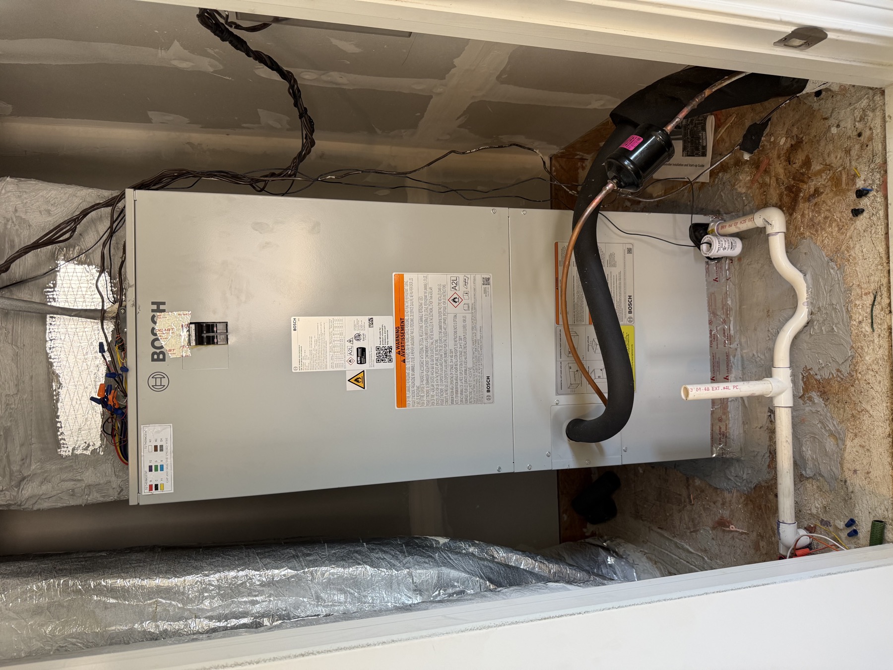 Bosch air handler installed cleanly in a Waxhaw area utility closet by EZ Heating and Cooling