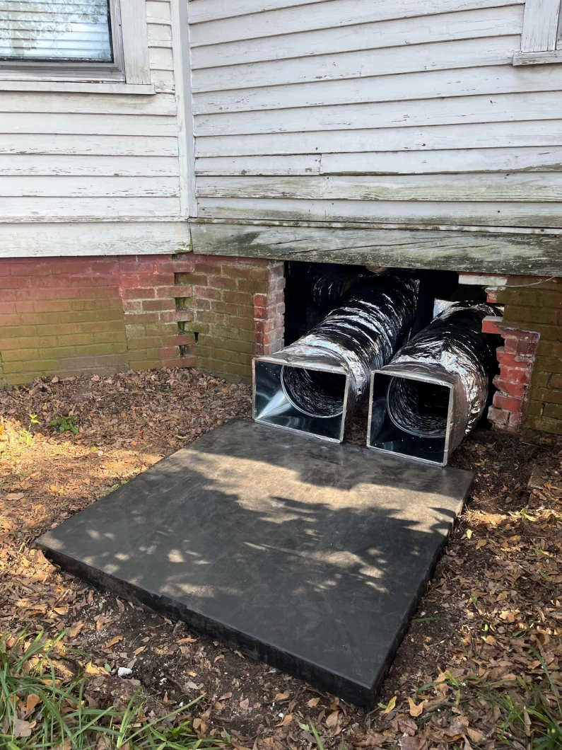 Insulated duct trunks running from a crawlspace at a Carolina home serviced by EZ Heating and Cooling